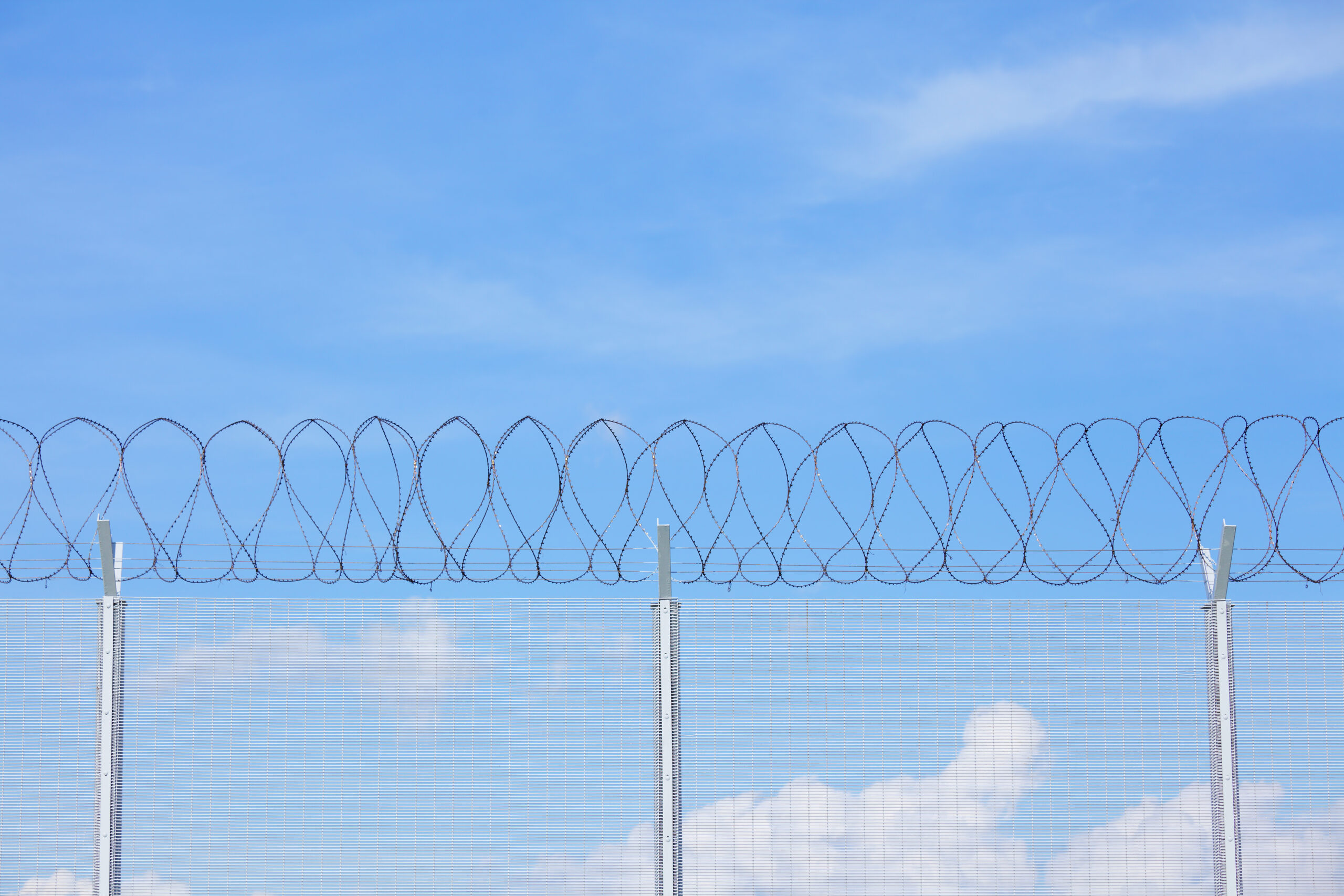 Chain link fence with barbed wire